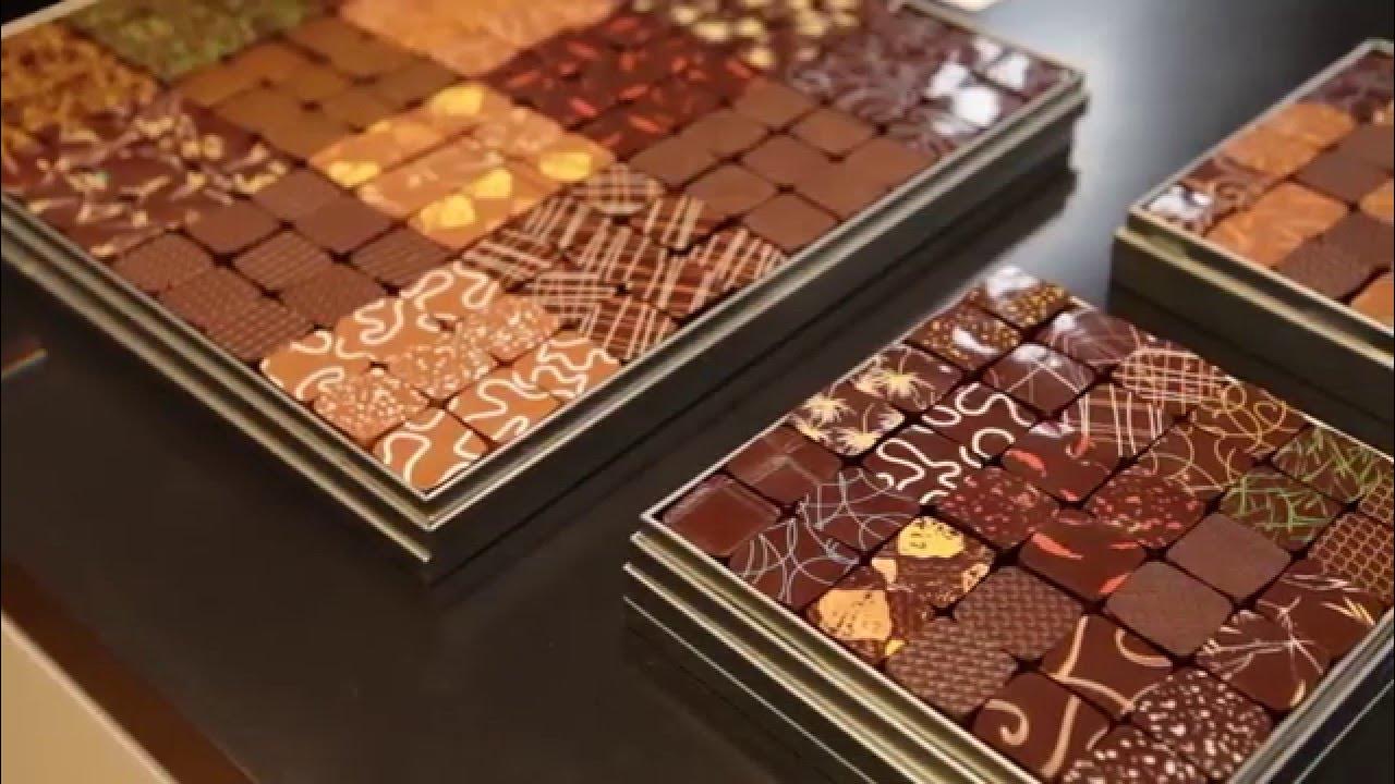 Jacques Genin chocolate shop interior in Paris, featuring minimalist decor and handcrafted gourmet chocolates.