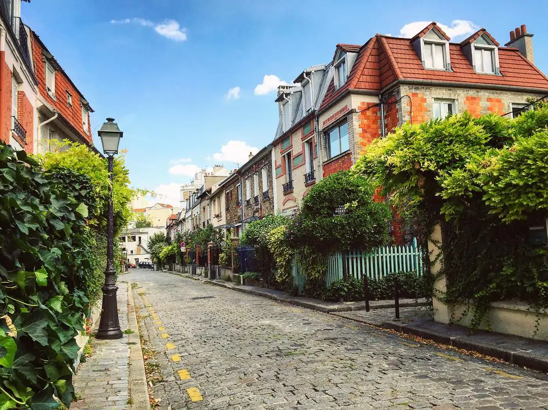 La Campagne à Paris, a secret residential area with cobblestone streets and flower-filled gardens in eastern Paris.